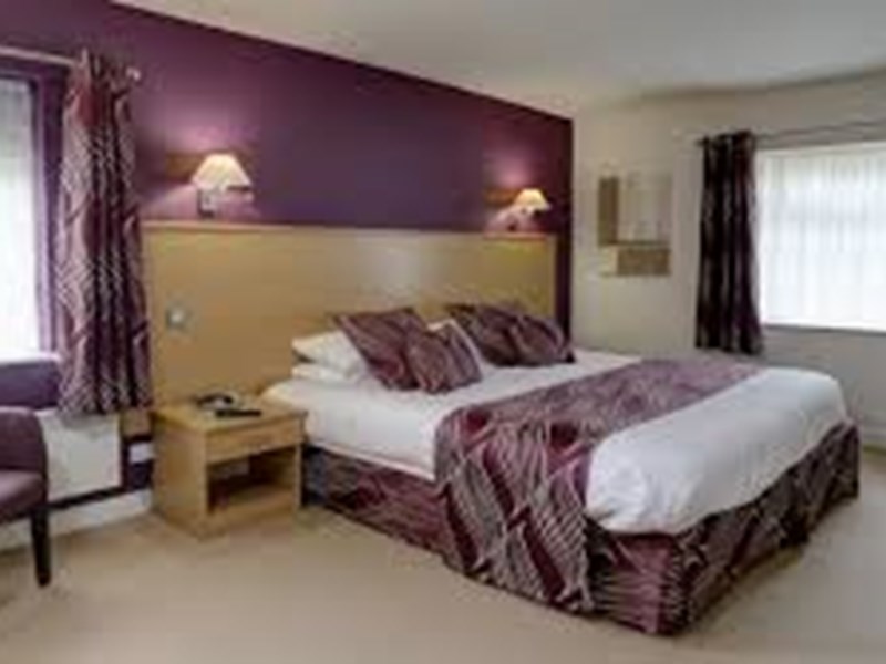 Deluxe bedroom at Best Western Plus Mosborough Hall Hotel with king-size bed and modern furnishings.