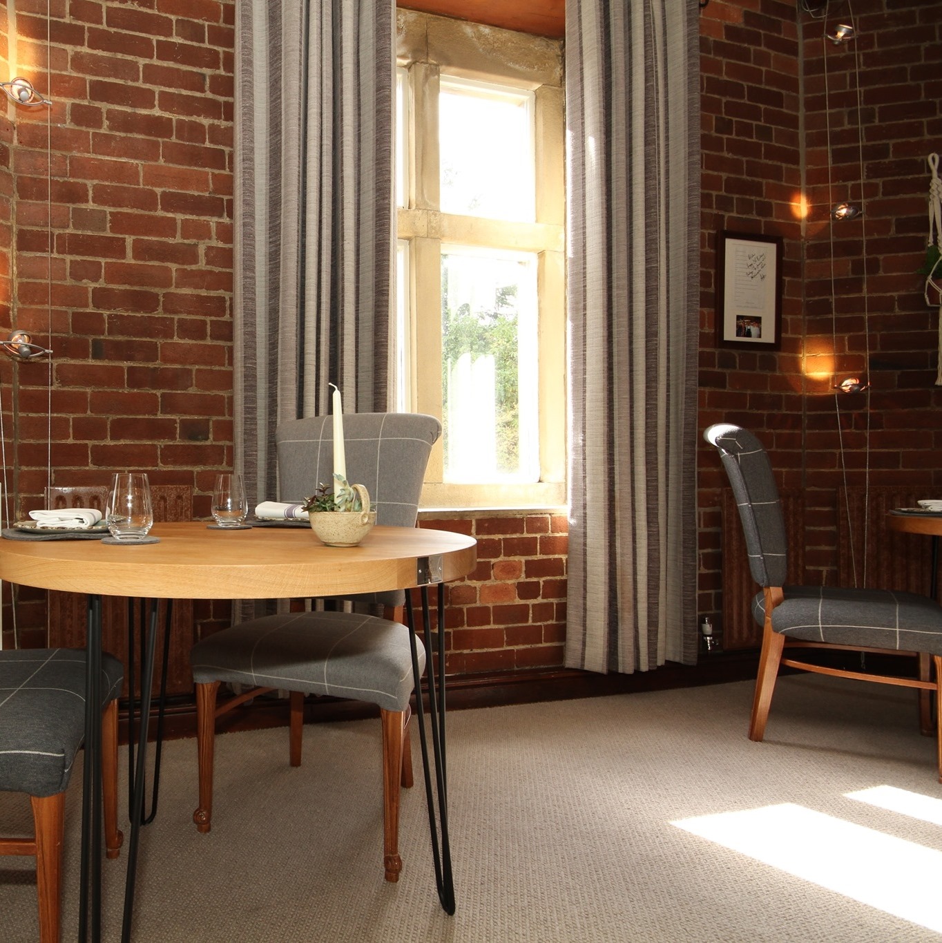 A table and chairs by a window.