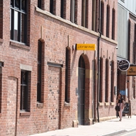 The exterior of a red brick building.