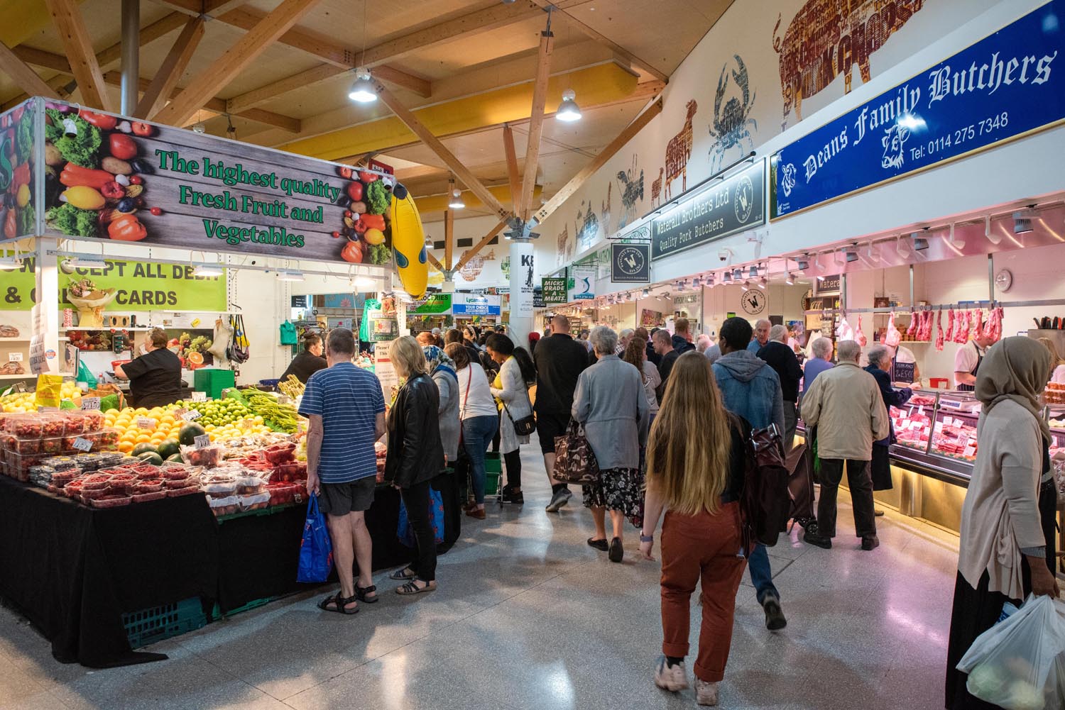 Stalls at The Moor Market surrounded by shoppers.