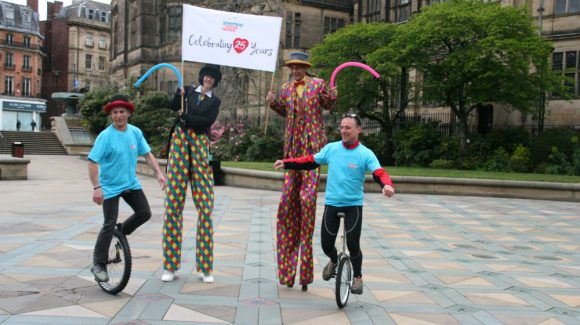 Members of the Greentop Community Circus Centre performing in Sheffield city centre.
