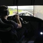 A man playing a racing simulator at Simulation Station.