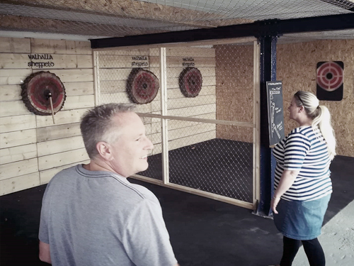 People having fun at Valhalla Axe Throwing.