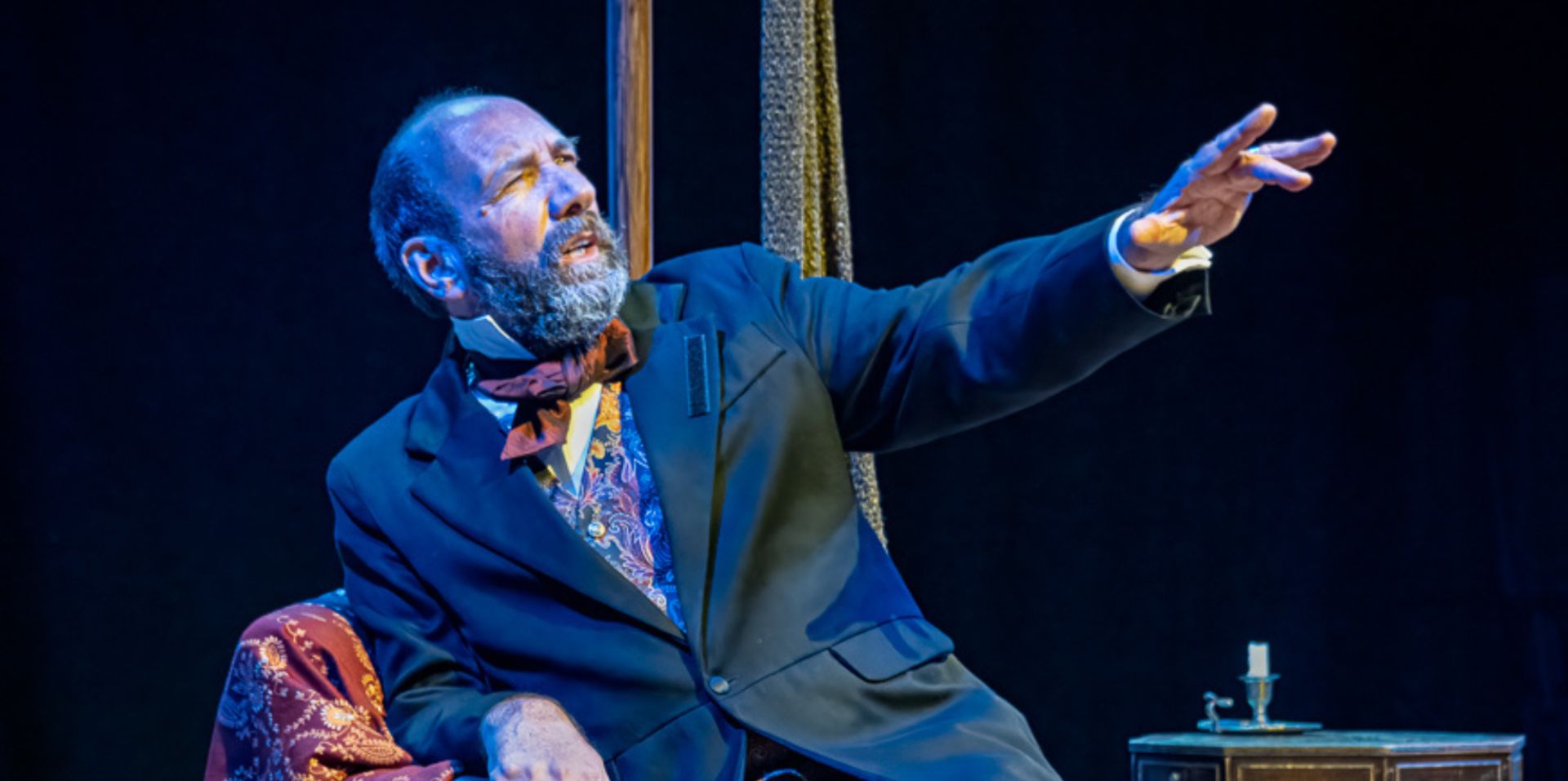 A man performs in period dress.