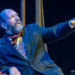 A man performs in period dress.