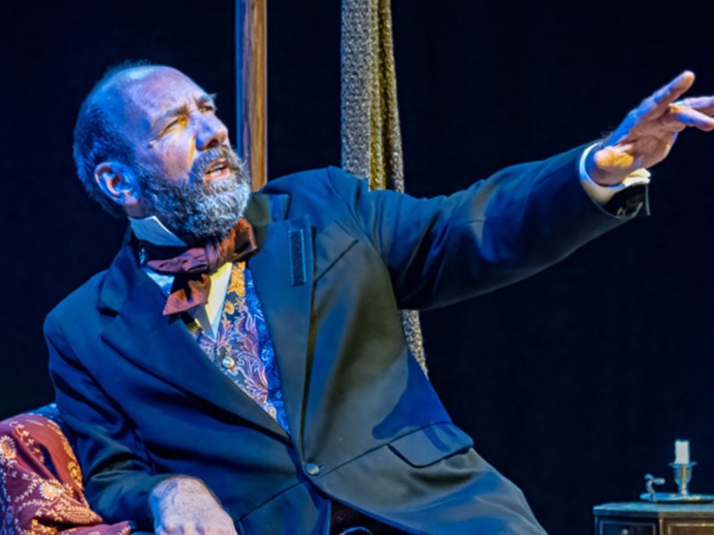 A man performs in period dress.