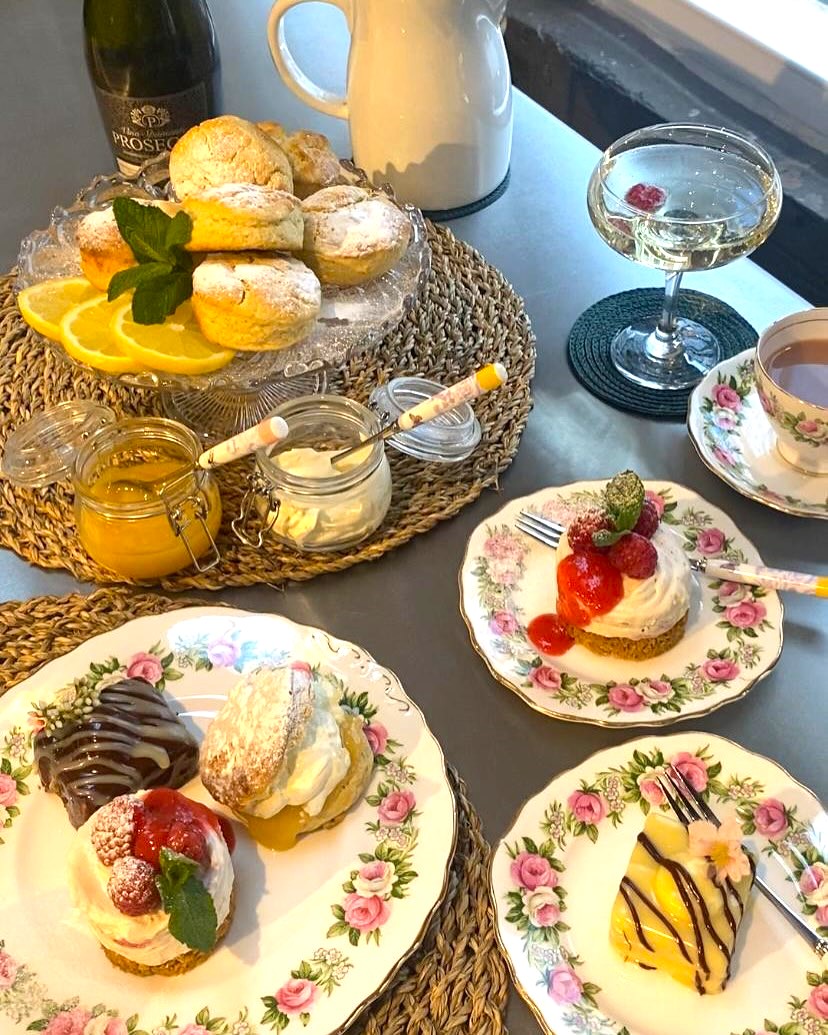 Various cakes and desserts on display.