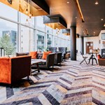 Contemporary bar area with large, comfortable seats and modern decor.