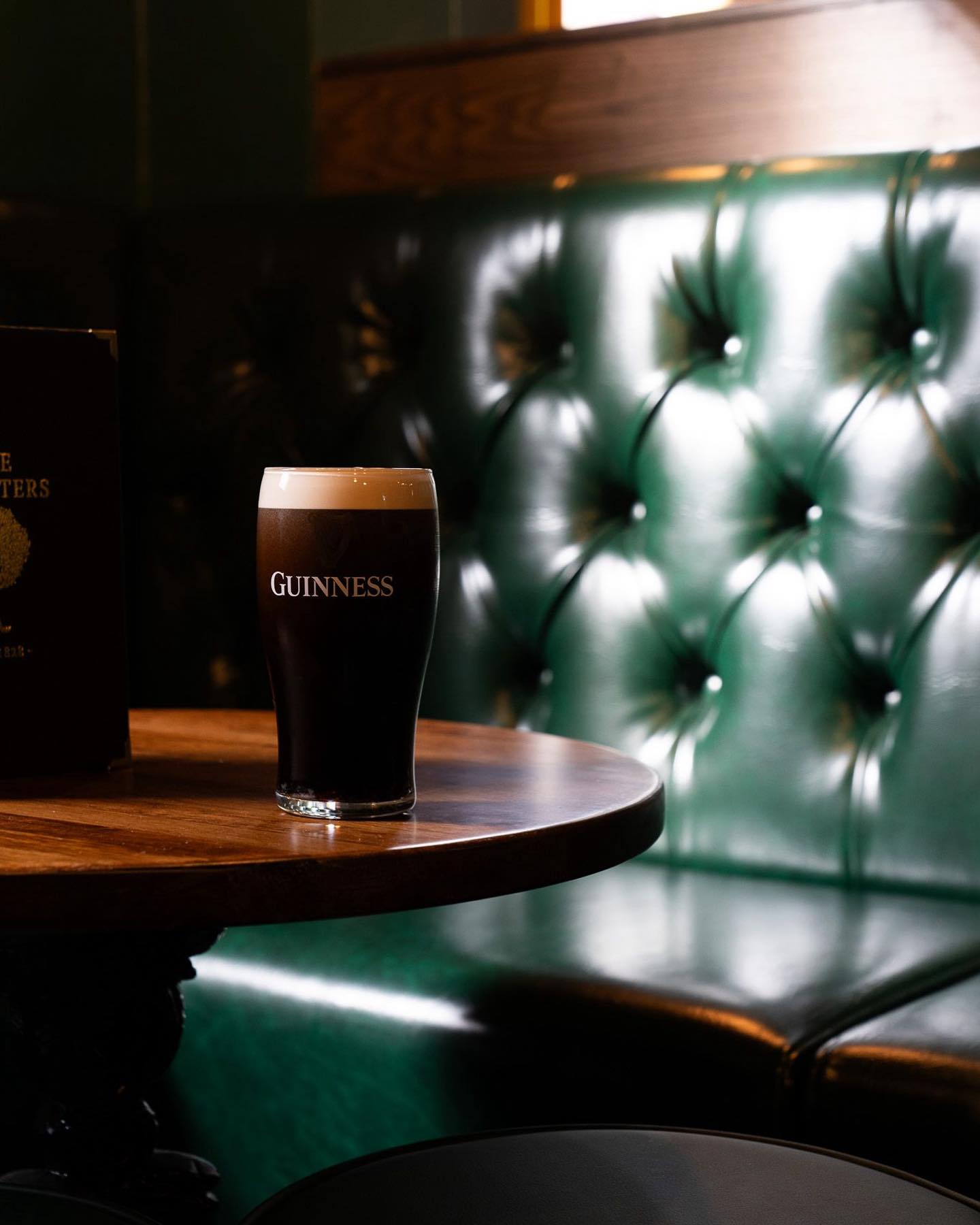 A booth and a pint of Guinness at The Foresters.