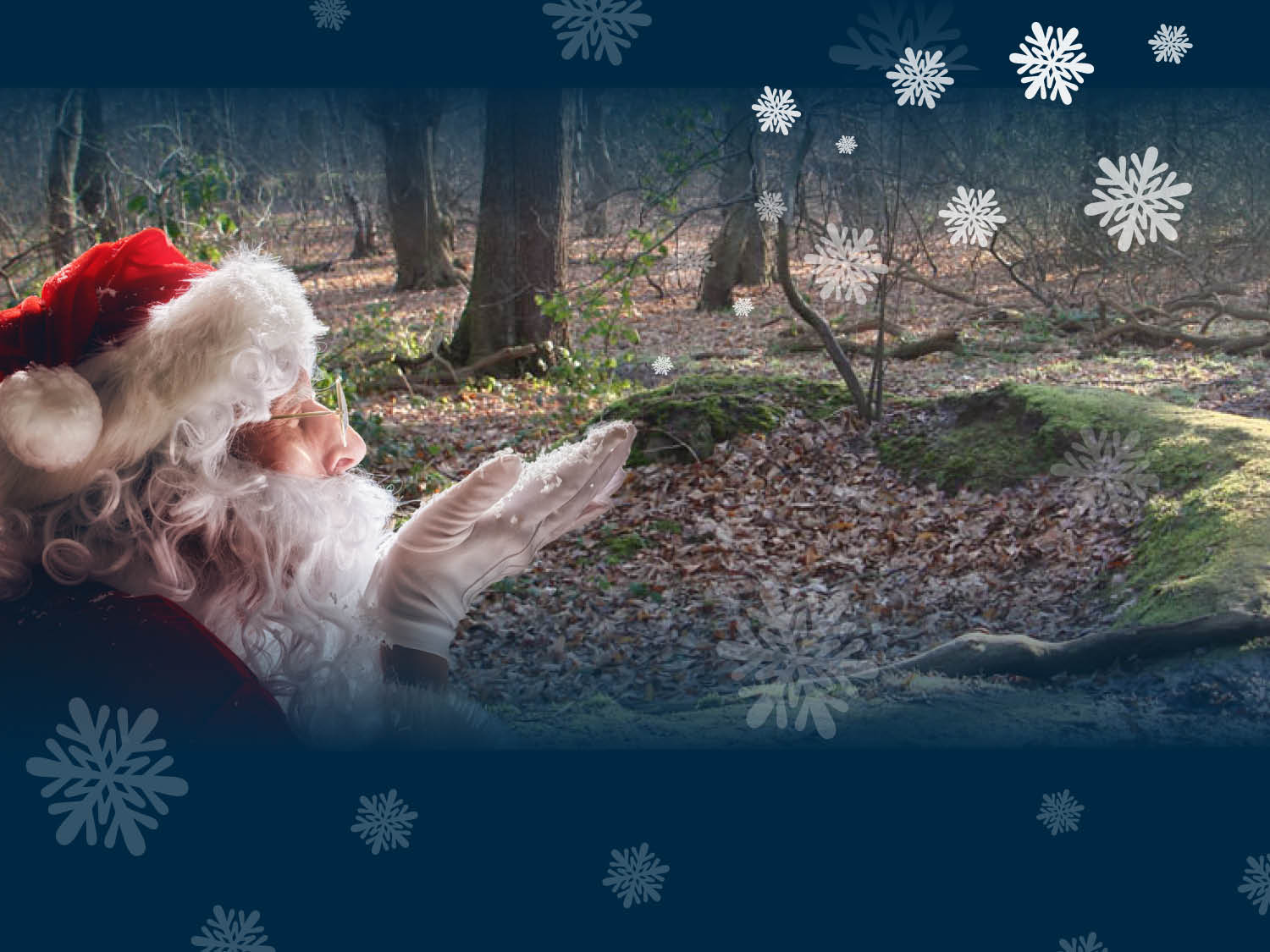 A person dressed in a traditional Santa Claus outfit with a red hat, white fur trim, and white gloves is standing in a forest clearing. The ground is covered with fallen leaves, and moss-covered tree roots are visible. Bare trees surround the area, suggesting a winter setting. Decorative snowflake graphics overlay the image, adding a festive touch.