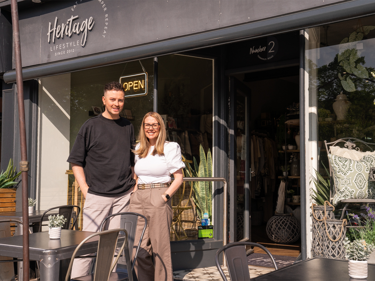 A couple standing outside Heritage Lifestyle