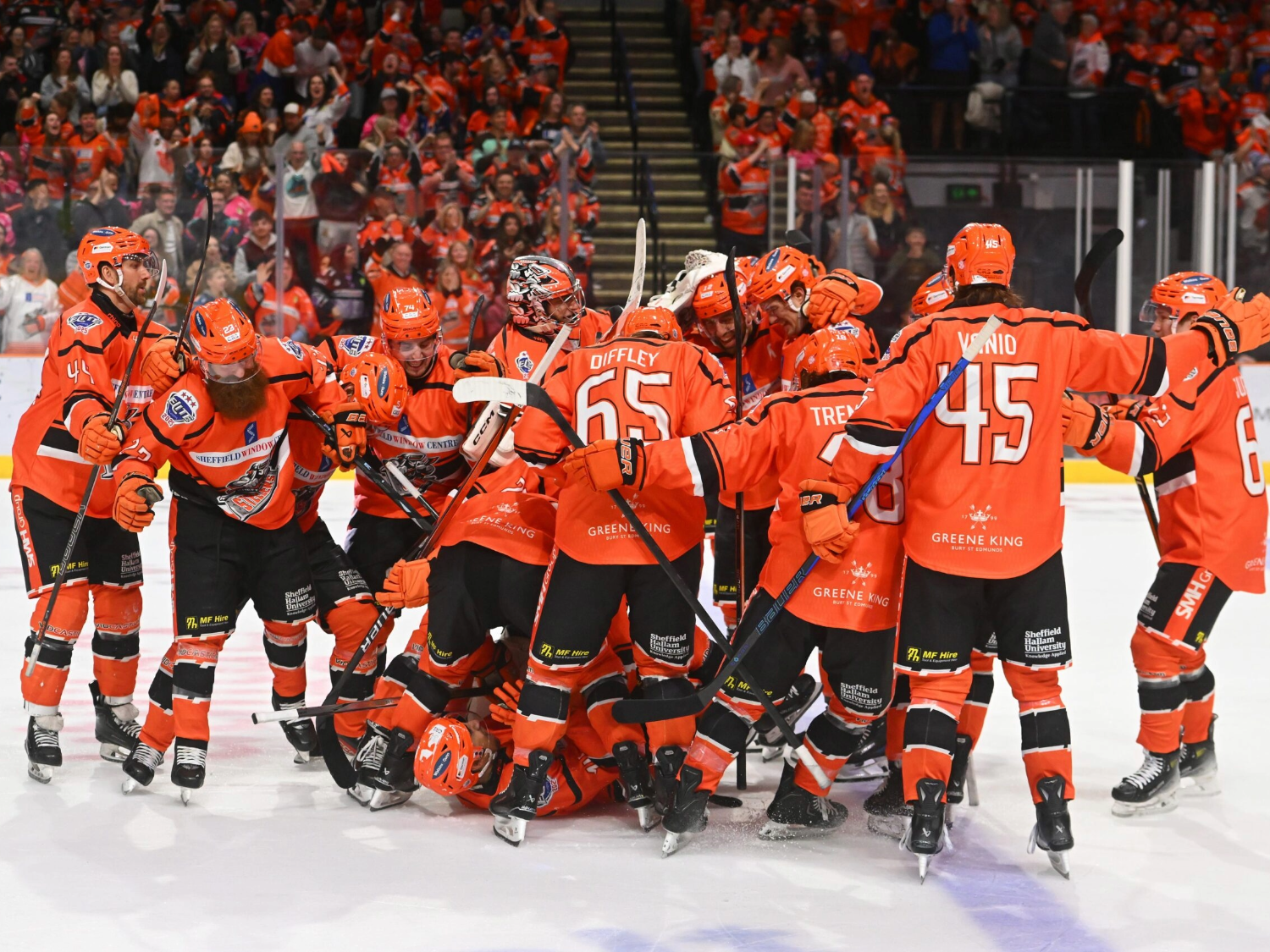 Members of the Sheffield Steelers ice hockey team on the ice at Utilita Arena.