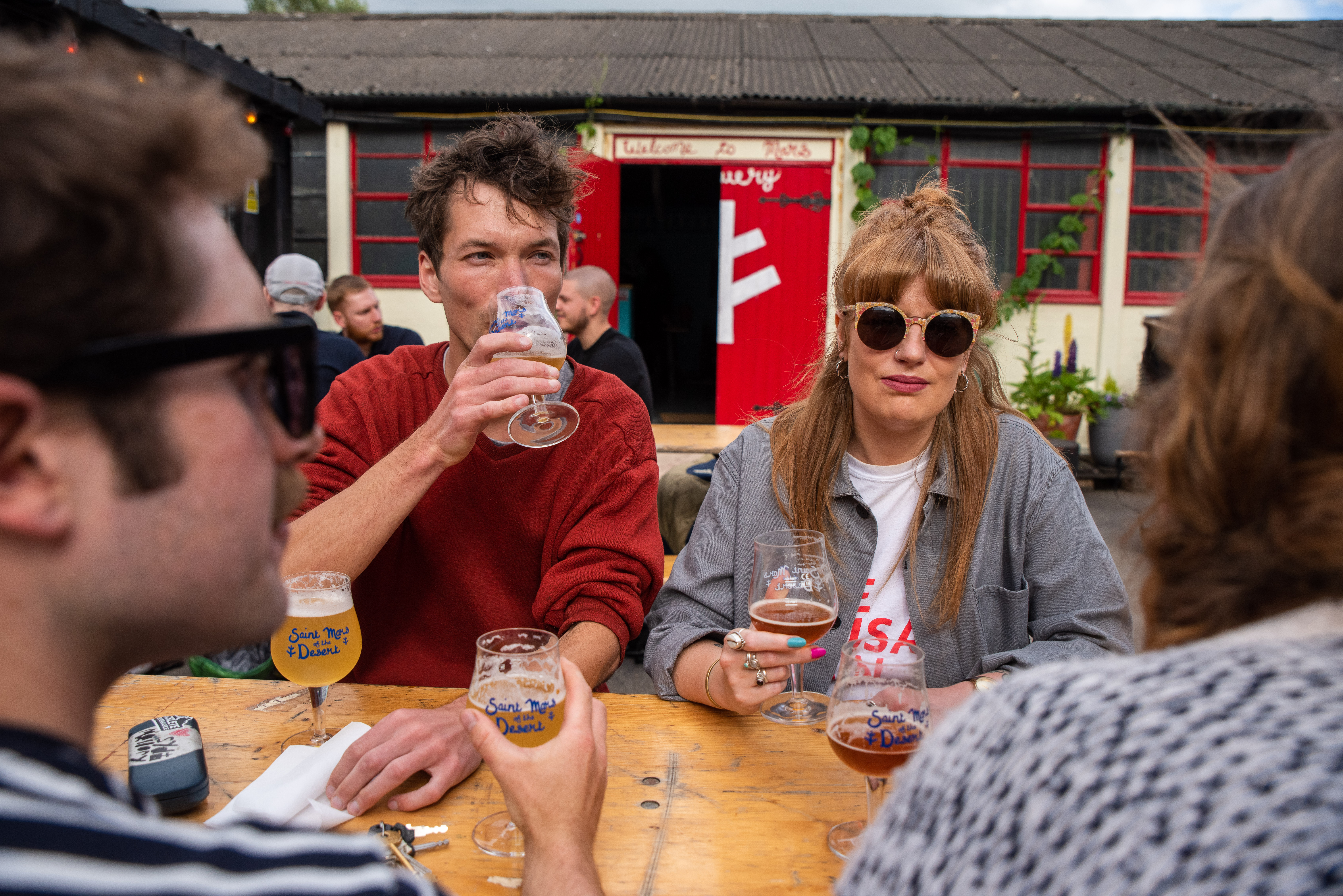 People drinking outdoors at The Brewery of St Mars of the Desert.