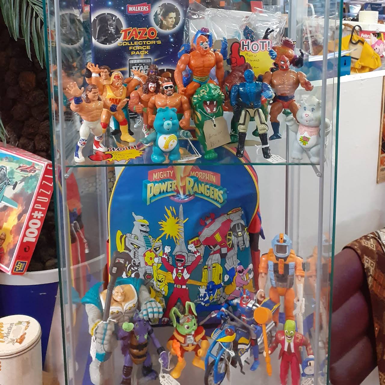 A glass case full of toys for sale at The Indie Arcade.