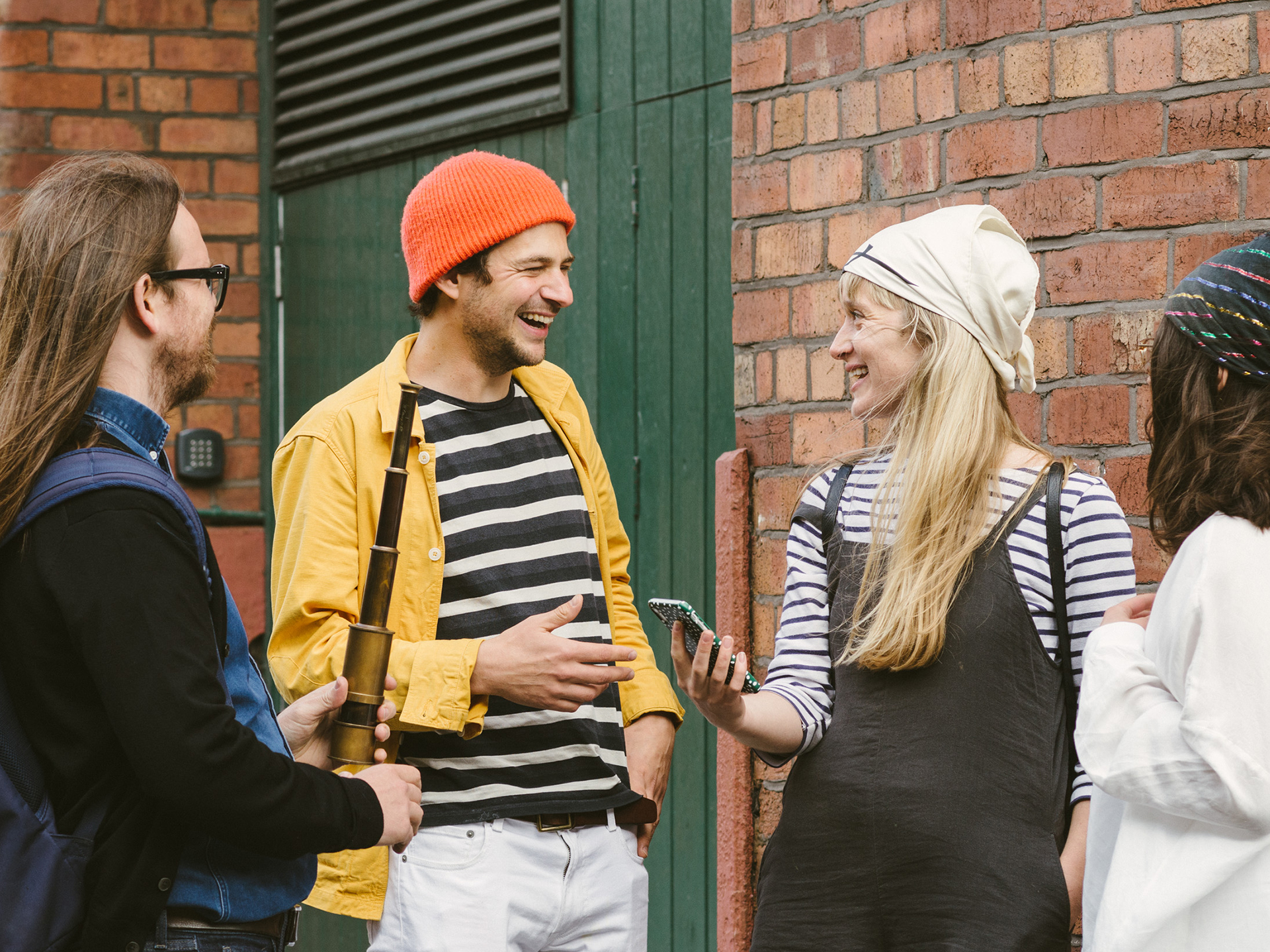 Four people getting ready to set off and play Treasure Hunt Sheffield.