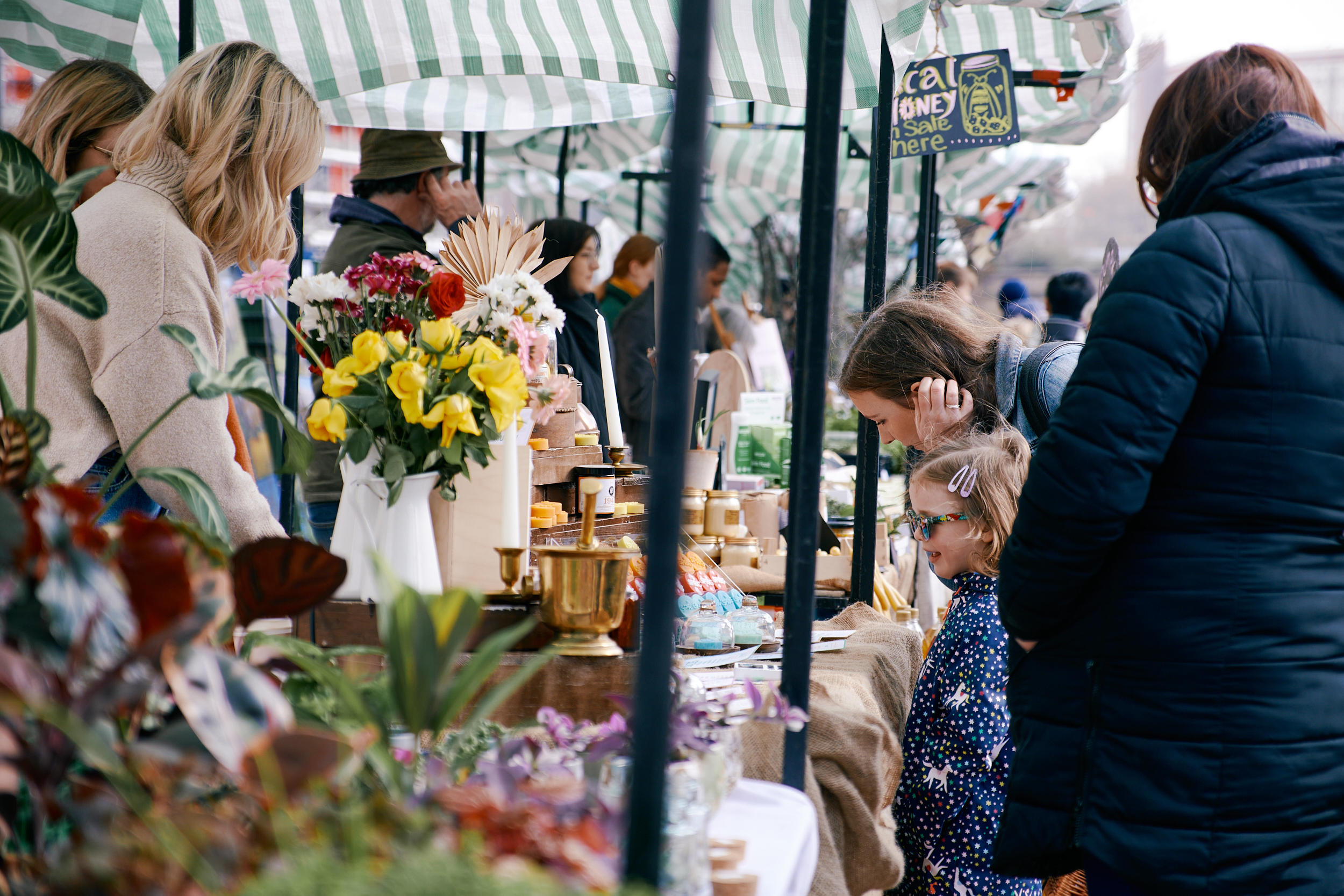 People looking at stalls at Pollen Market.