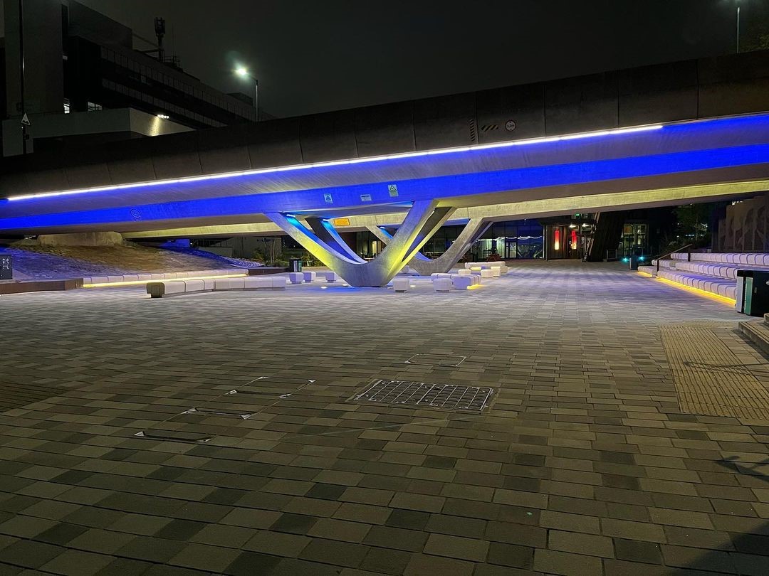 neon lighting under the bridge, next to the concourse outside the University of Sheffield Students' Union