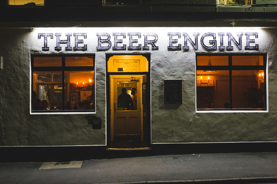 Exterior shot of The Beer Engine, lit up at night.