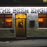 Exterior shot of The Beer Engine, lit up at night.