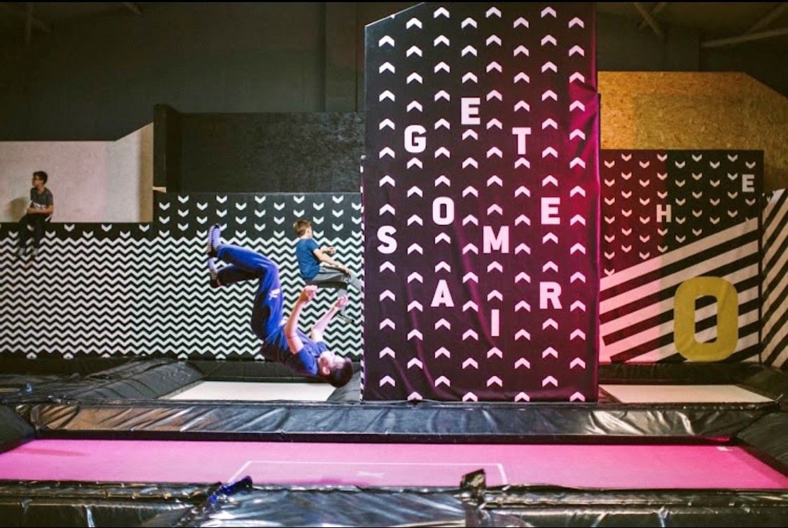 People having fun and jumping on trampolines at Jump Inc.