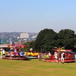 Colourful fairground ride with people enjoying themselves at the Sheffield Fayre.