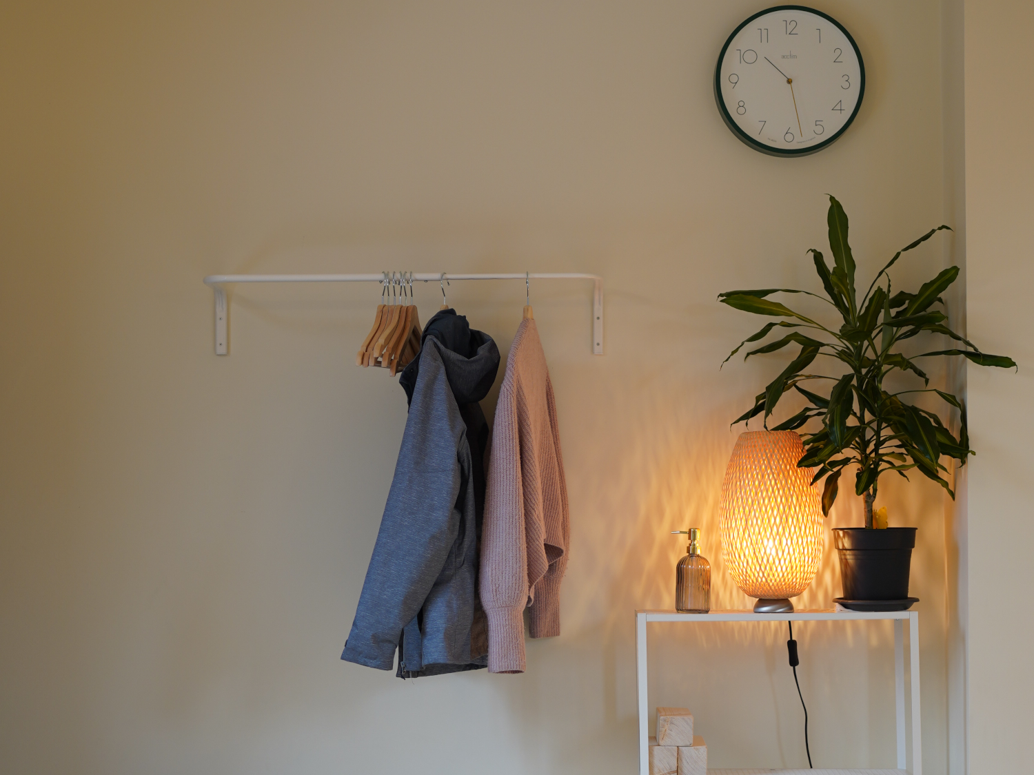 A rack with coats hanging up at Ting Studio
