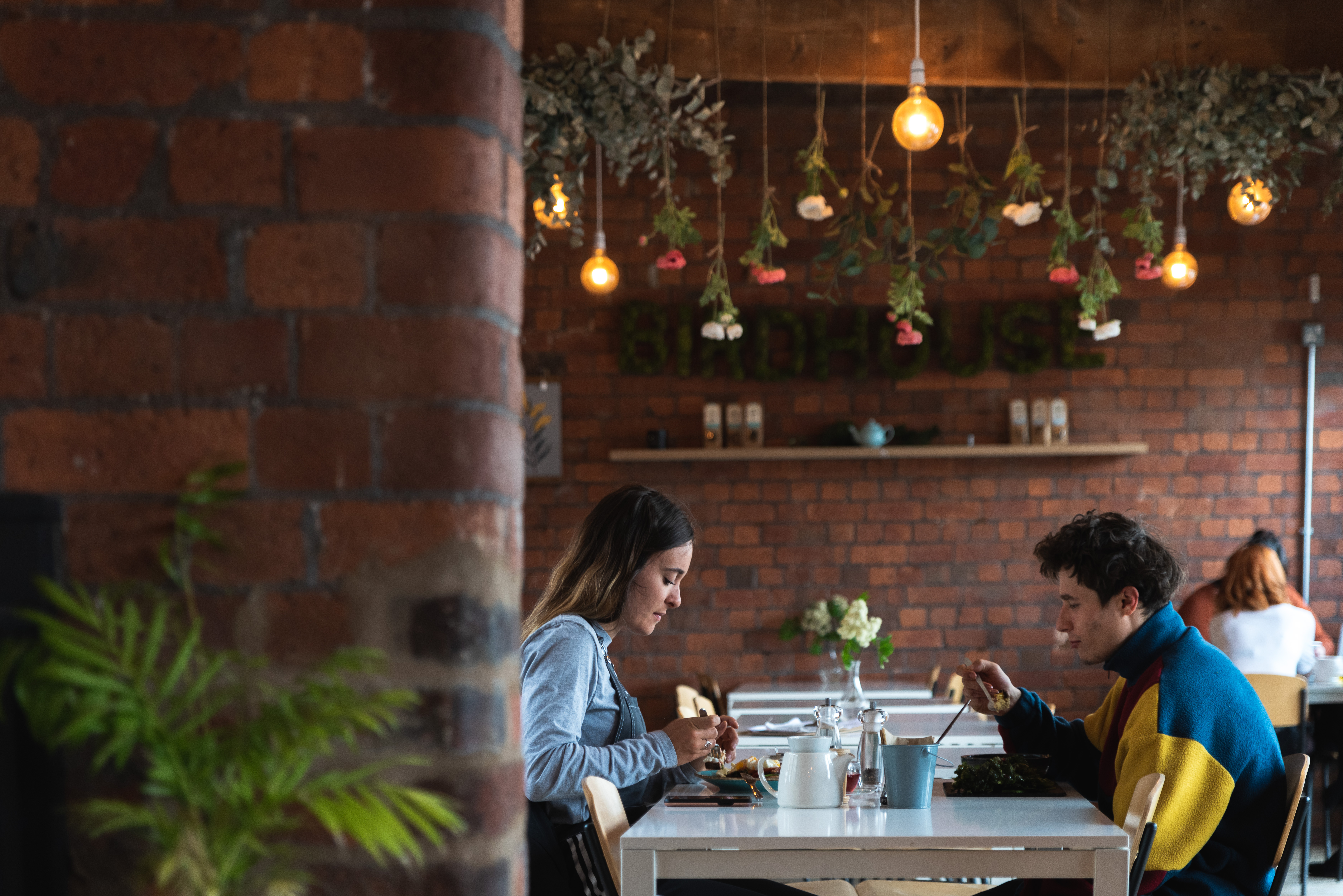 Two people dining at the Birdhouse Tea Bar & Kitchen.