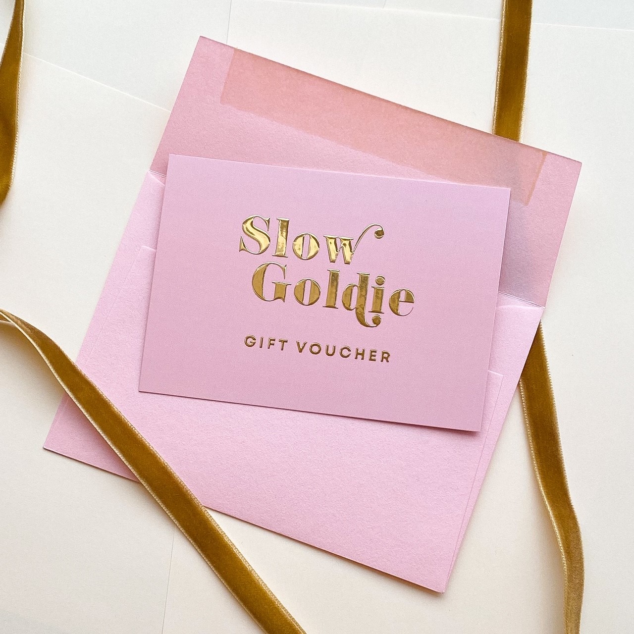 An example of ALD Print's work, pink stationary with embossed gold print.