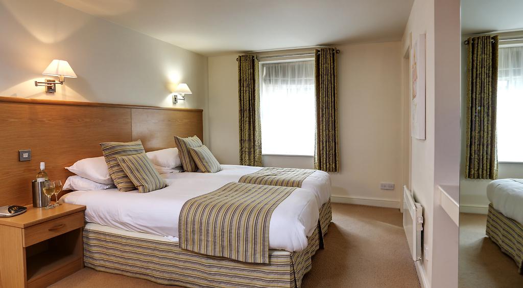Double bedroom at Best Western Plus Mosborough Hall Hotel with double bed and bedside tables.
