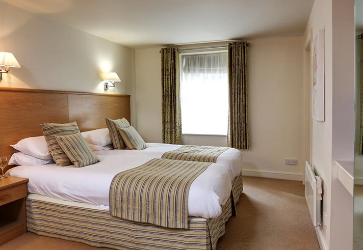 Double bedroom at Best Western Plus Mosborough Hall Hotel with double bed and bedside tables.