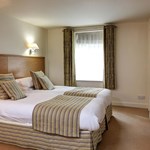 Double bedroom at Best Western Plus Mosborough Hall Hotel with double bed and bedside tables.