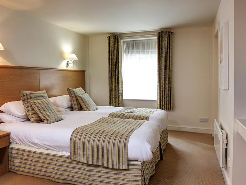 Double bedroom at Best Western Plus Mosborough Hall Hotel with double bed and bedside tables.