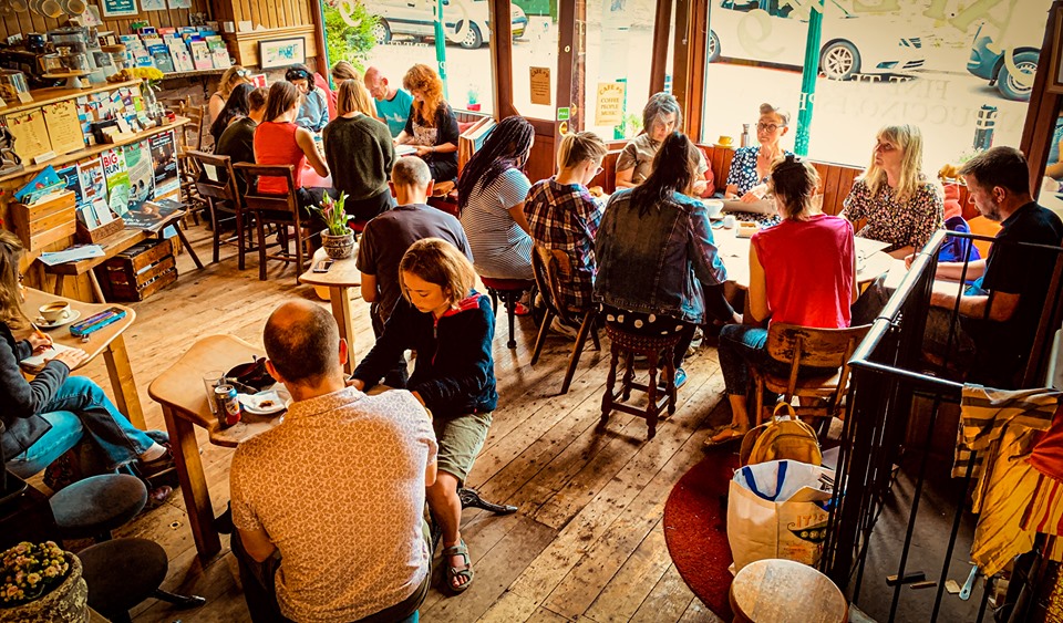 The interior of Cafe #9 filled with customers.