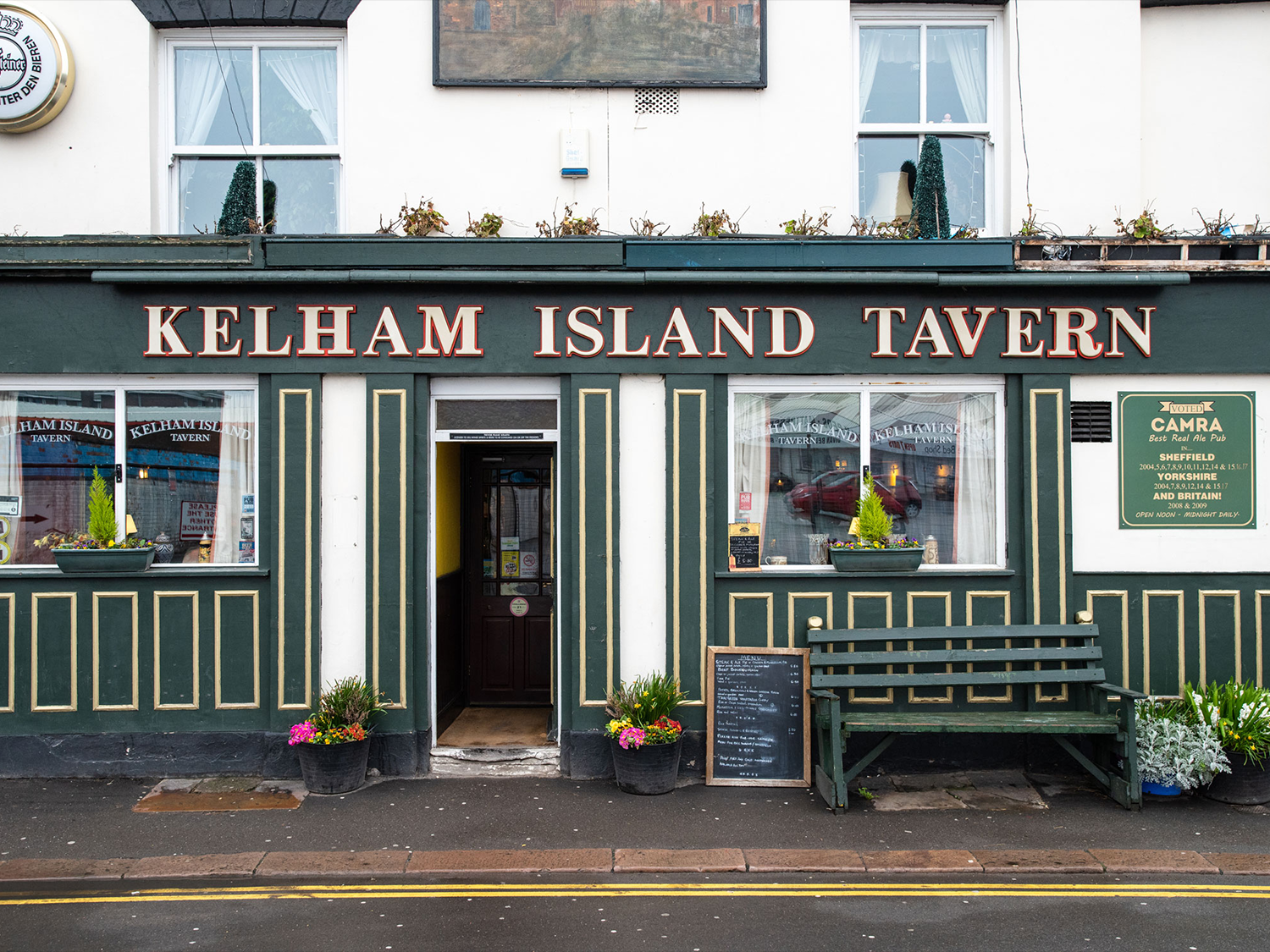 The exterior of the Kelham Island Tavern public house in Sheffield, painted in white green and gold.