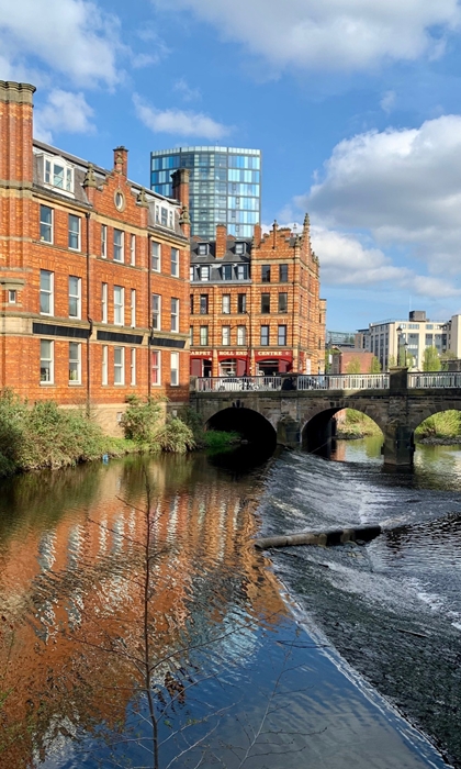 A weir on the River Don in the centre of Sheffield. In the background is Lady's Bridge.