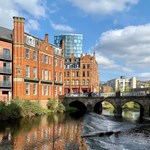 A weir on the River Don in the centre of Sheffield. In the background is Lady's Bridge.