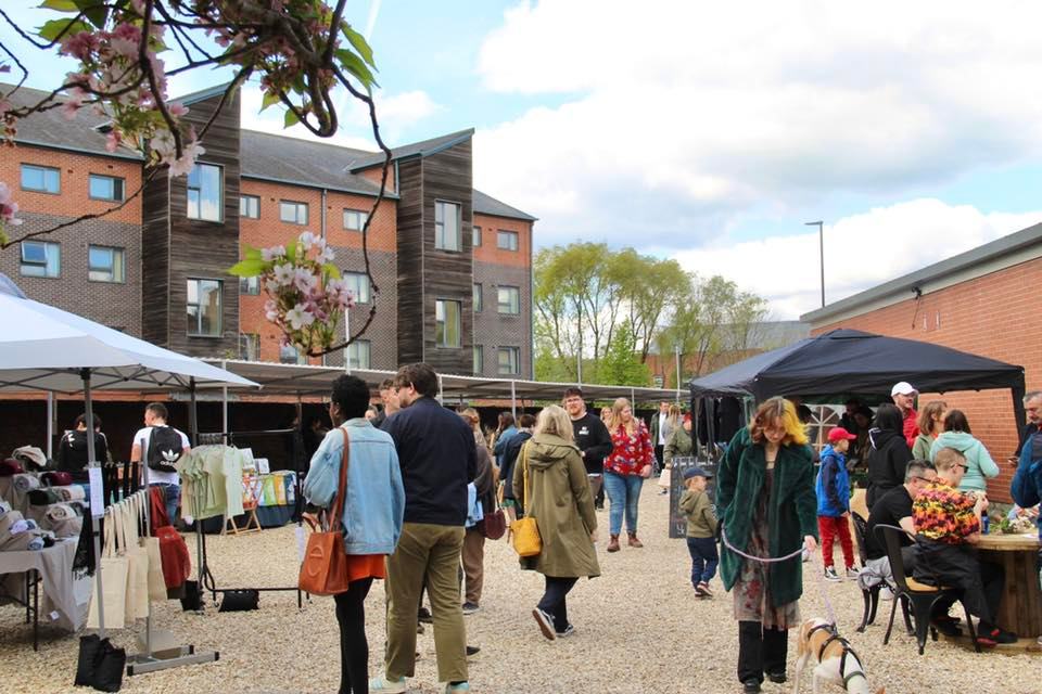 People strolling around the stalls at Rex Market.