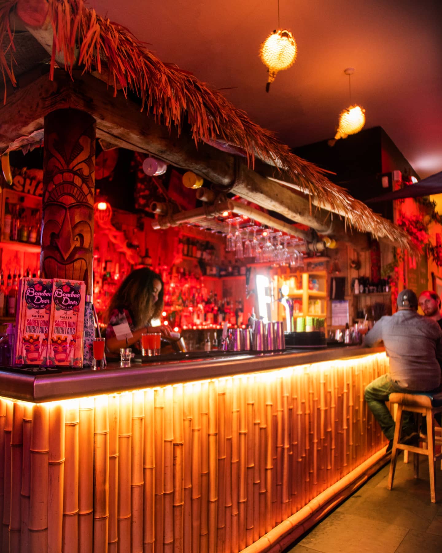 The bar, decorated in a Tiki style, at the Bamboo Door.