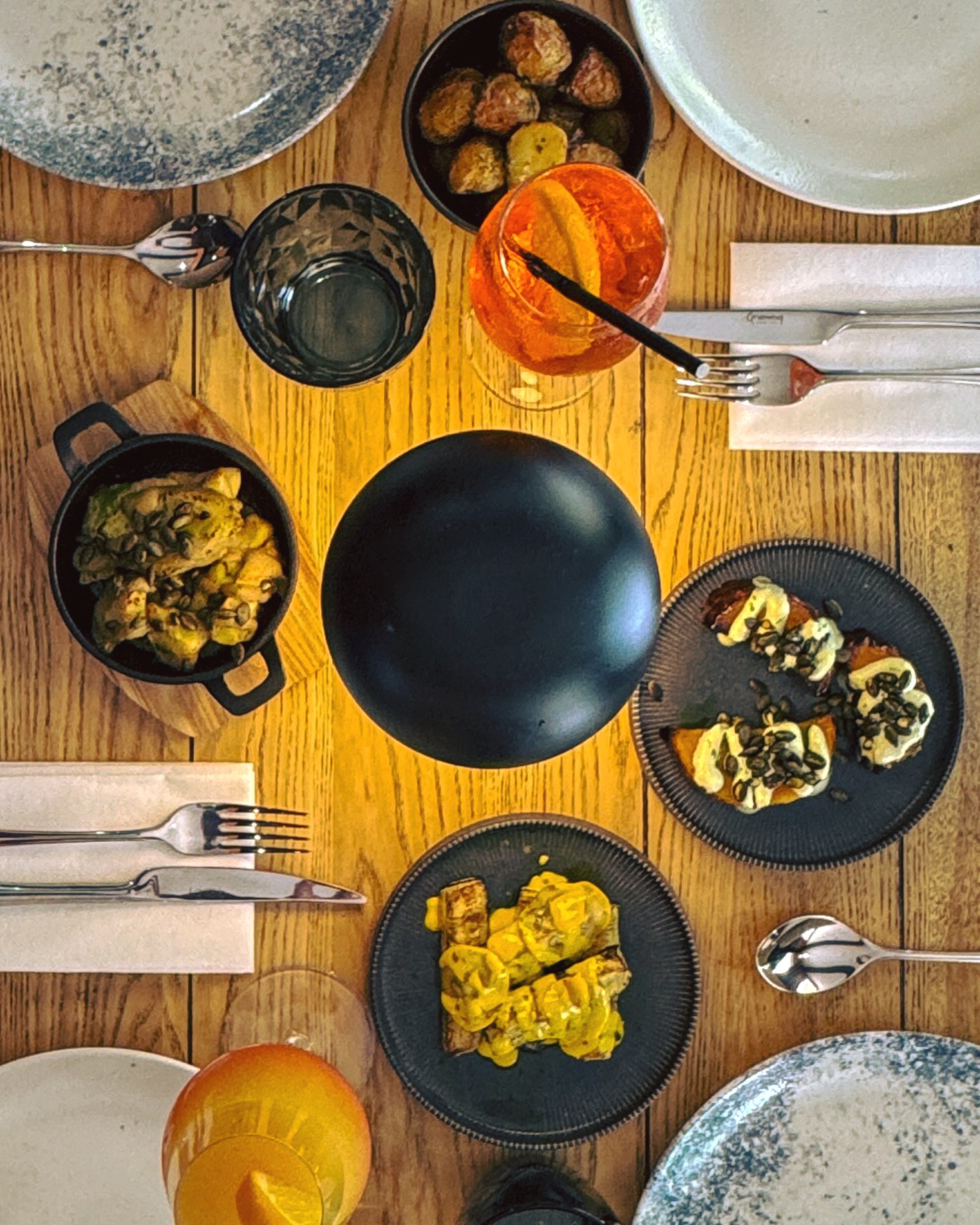 An overhead shot a meal laid out on a wooden table.