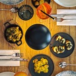 An overhead shot a meal laid out on a wooden table.