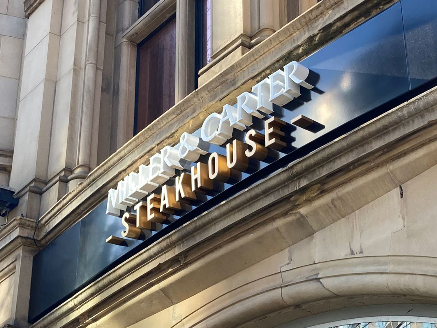 The Miller & Carter Steakhouse sign above the entrance to the restaurant.