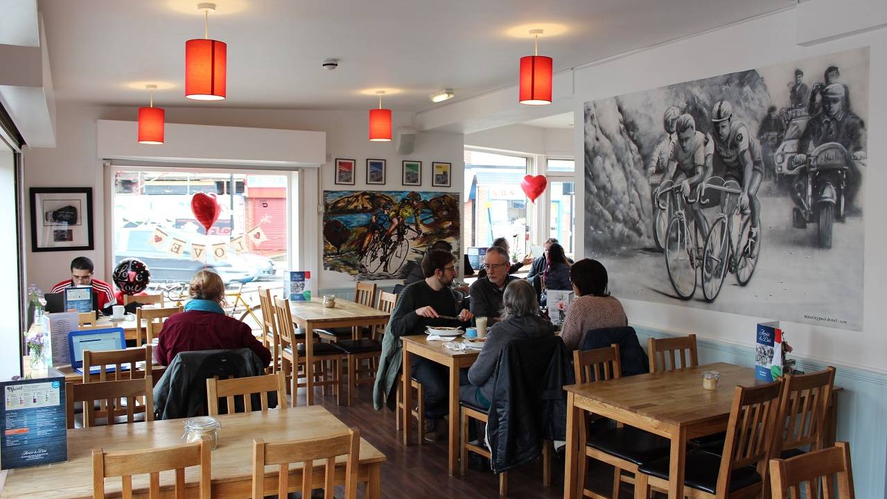 The clean, modern interior of Amici & Bici, with lots of cycling memorabilia.