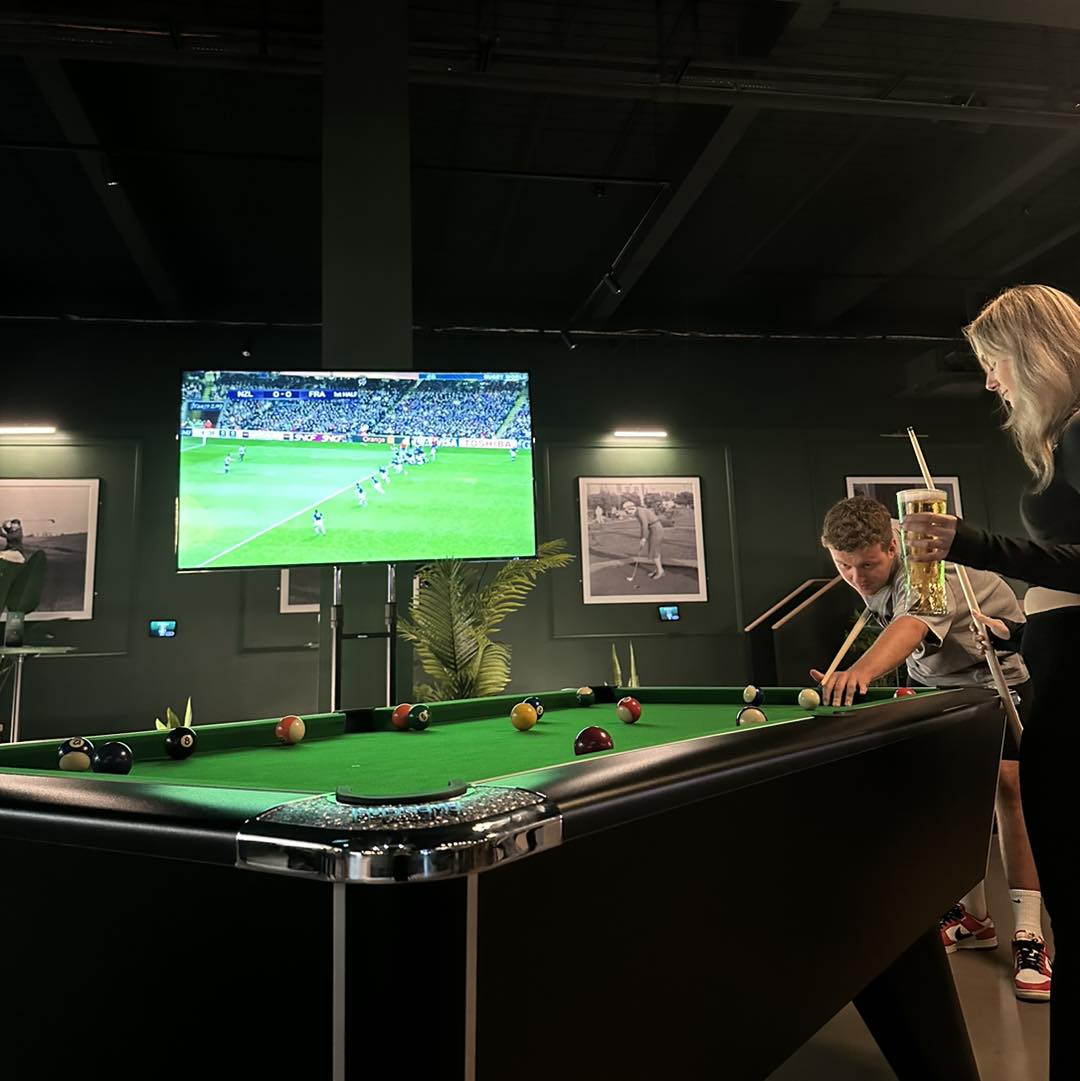 People playing pool at Clubhouse.