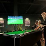 People playing pool at Clubhouse.