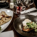 A meal for two laid out on a table at Inox Dine.
