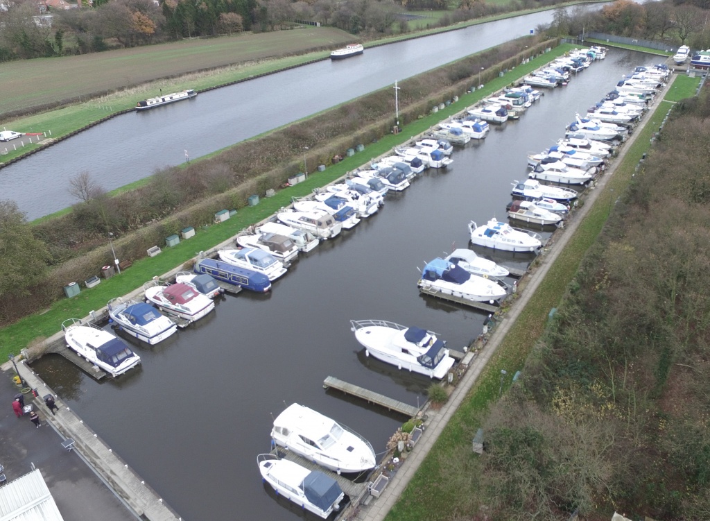 Two rows of boats in a marina.