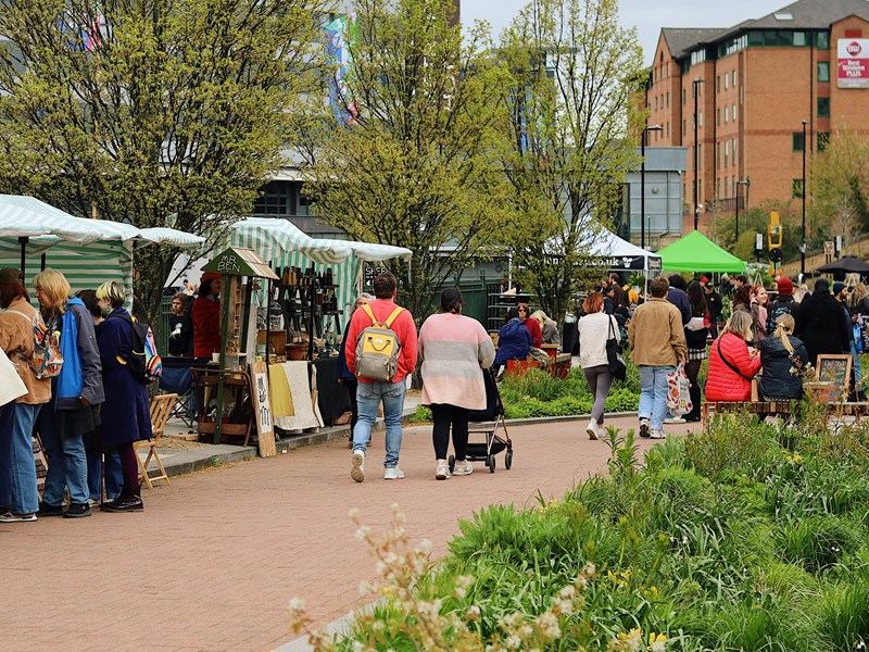 Crowds walking along Pollen Market