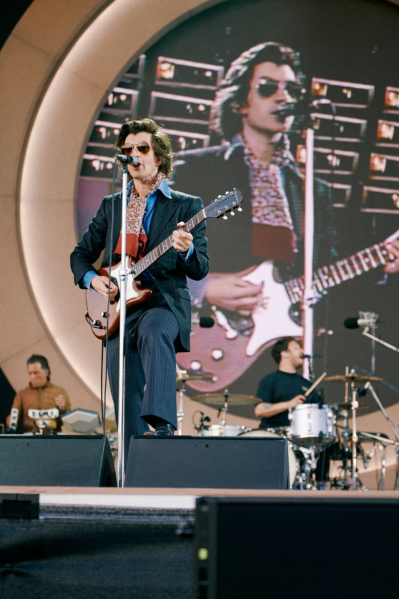  Alex Turner singing and playing guitar on stage at the Arctic Monkeys show in Hillsborough Park 