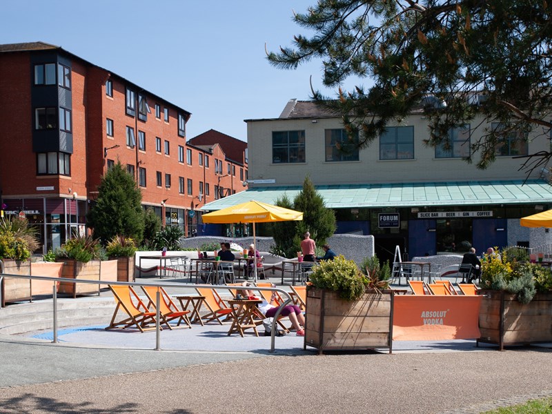 Seating area outside the Forum Kitchen + Bar.