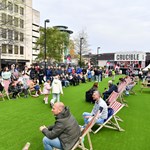 Tudor Square, in Sheffield city centre, is thronging with people, who have come to watch the snooker at The Crucible. Some people are sat on deck chairs watching the matches on a big screen.